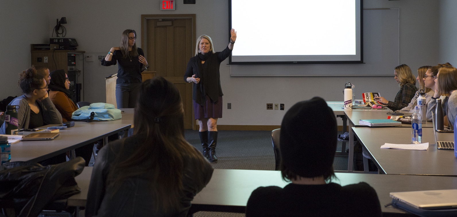 Jen Schweer and Laura Kovach team teach students in their Women's and Gender Studies course.